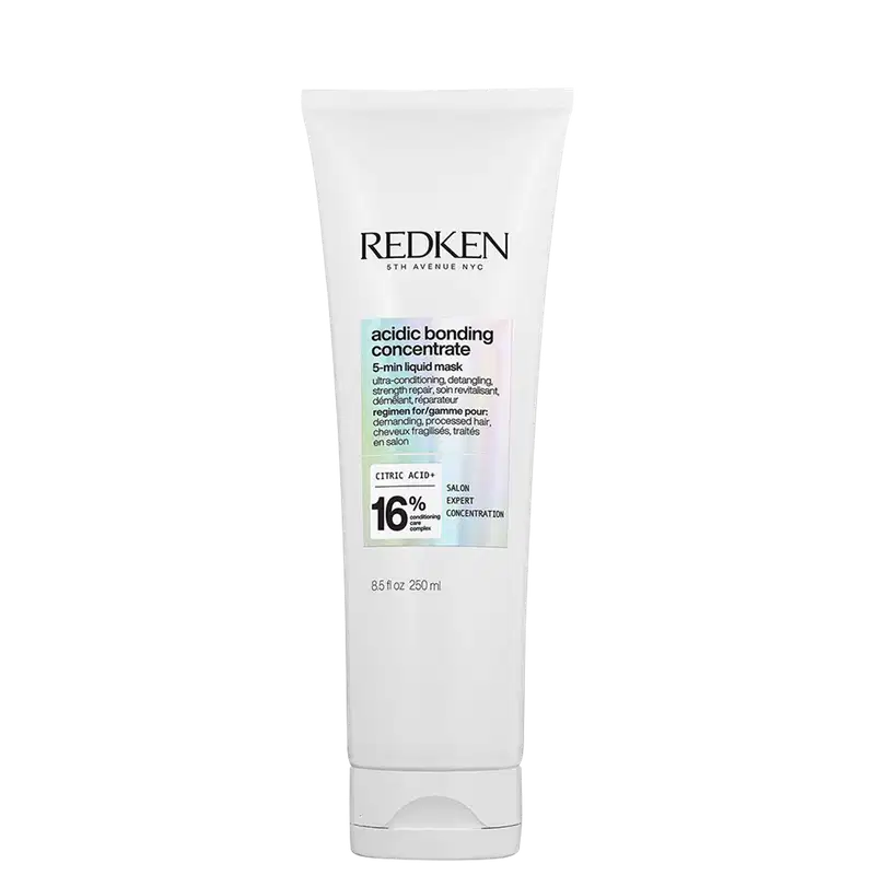Tubo branco com rótulo preto e azul claro. Texto "Redken 5th Avenue NYC" e "Acidic Bonding Concentrate 5-min Liquid Mask". Informações sobre ingredientes e concentração de ácido cítrico.