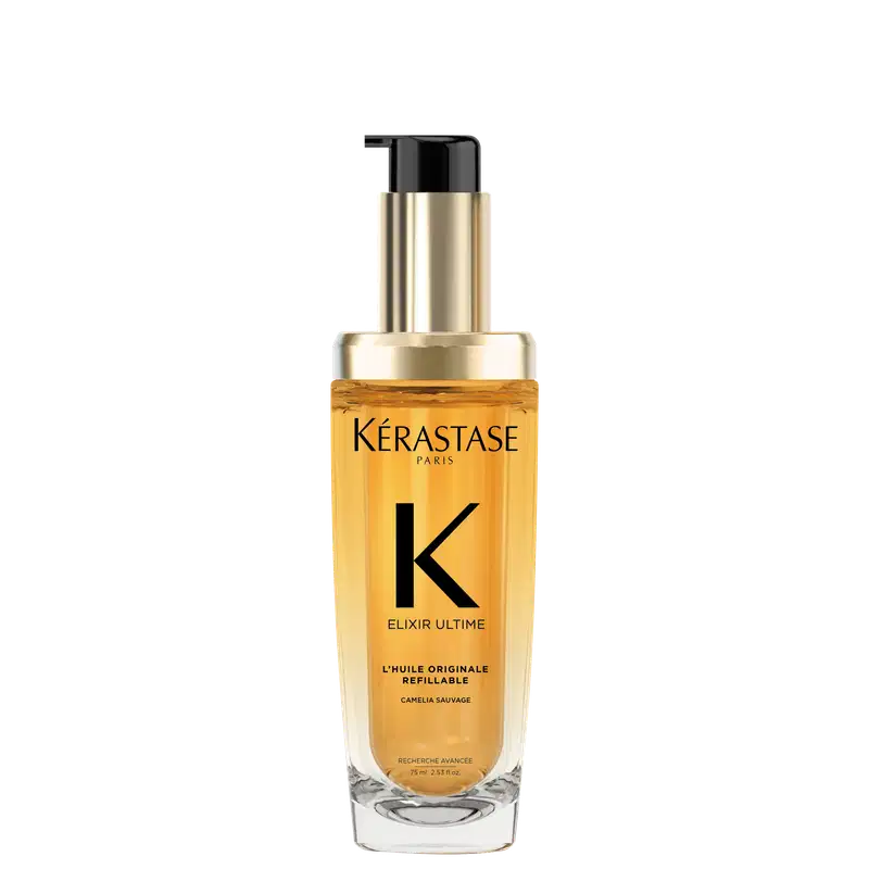 A imagem mostra o óleo capilar da marca Kérastase. O frasco é transparente, permitindo ver o líquido dourado dentro. O frasco tem um formato cilíndrico e uma bomba dosadora preta no topo. O rótulo apresenta letras pretas sobre um fundo dourado.