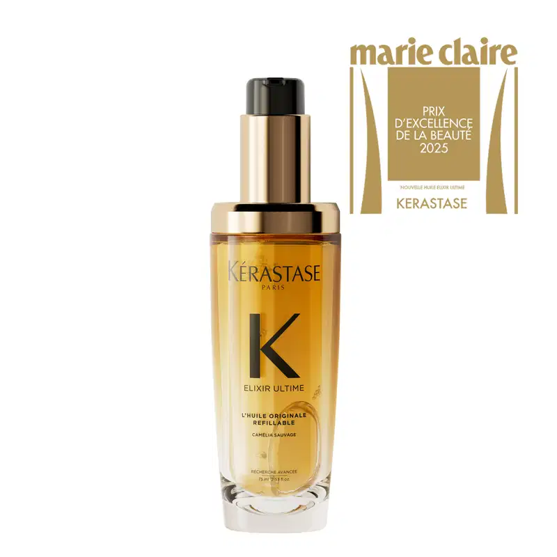 Frasco de vidro com líquido dourado, rótulo com a marca Kérastase e texto "Elixir Ultime L'huile Originale Refillable" e "Prix d'excellence de la beauté 2025".