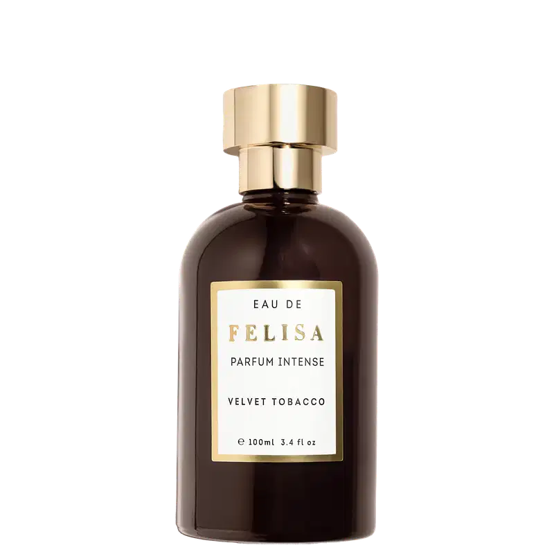 Perfume intenso Felisa Velvet Tobacco em frasco de vidro âmbar de 100ml. Embalagem cilíndrica com tampa dourada. Rótulo retangular dourado com texto "Eau de Felisa Parfum Intense Velvet Tobacco" em letras brancas.