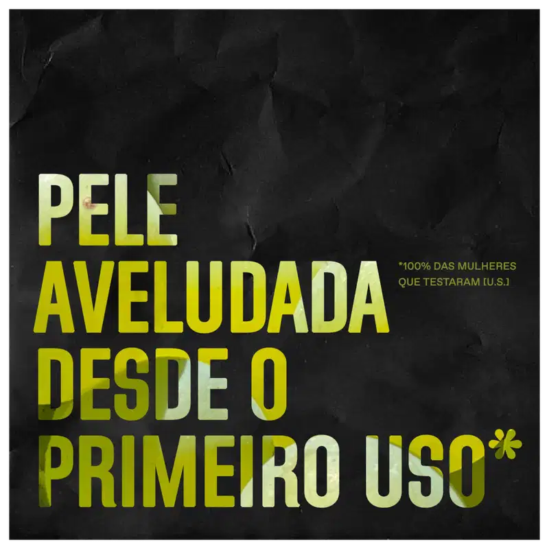 A imagem mostra um texto promocional em letras grandes e amarelo vibrante sobre um fundo preto. O texto destaca que é um produto para pele aveludada desde o primeiro uso.