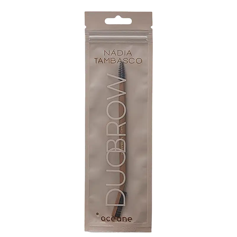 Embalagem de produto de beleza da marca Océane, contendo um pincel de sobrancelhas da linha Nadia Tambasco.