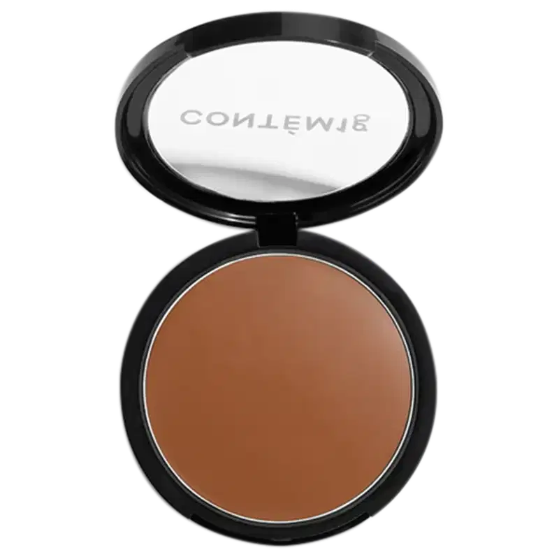 A imagem mostra uma embalagem aberta de bronzer cremoso. A embalagem é preta com parte transparente e o logo da marca em branco.