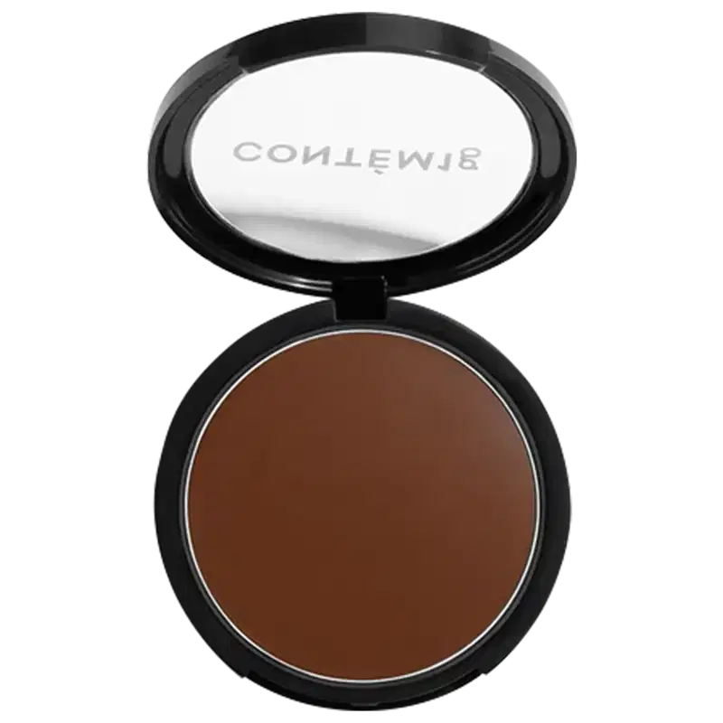 A imagem mostra uma embalagem aberta de bronzer cremoso. A embalagem é preta com parte transparente e o logo da marca em branco.