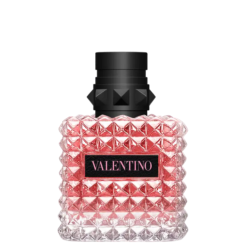 Frasco de perfume Valentino em formato geométrico, com tampa preta e corpo de vidro rosa brilhante, exibindo o nome da marca em destaque.