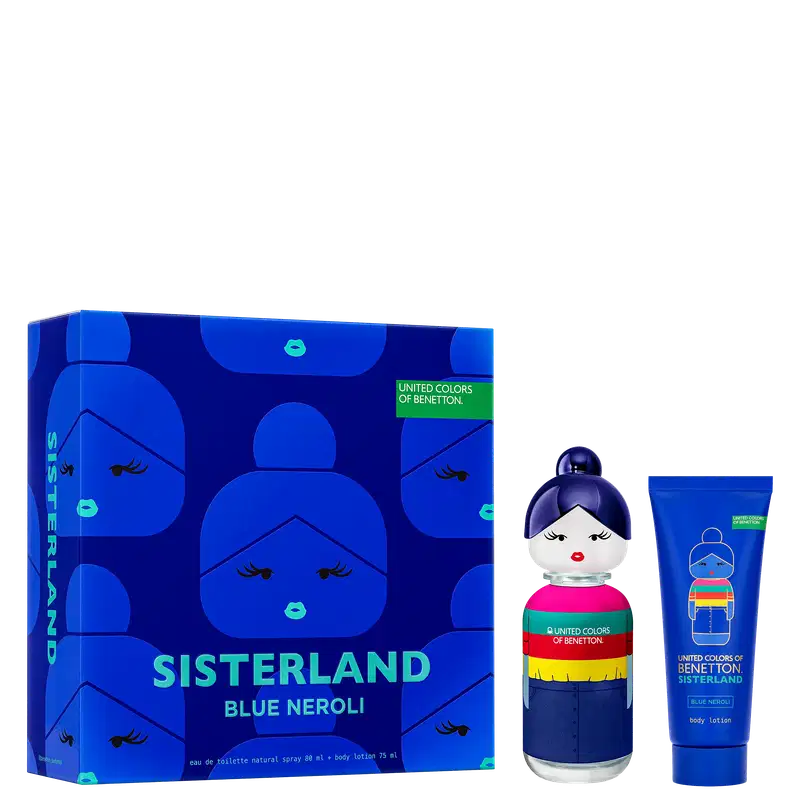 Conjunto da linha Sisterland da Benetton, composto por um frasco de perfume e um tubo de loção corporal. O frasco de perfume tem um design arredondado e colorido, de uma boneca. A embalagem externa é uma caixa azul com ilustrações de rostos estilizados.