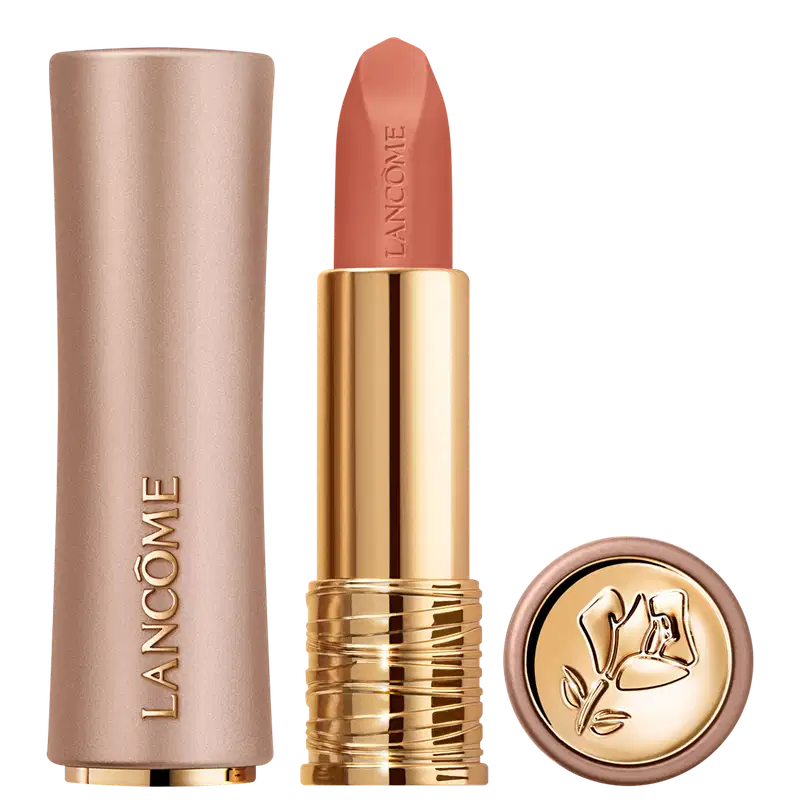 Embalagem dourada e rosa de um batom da marca Lancôme, com o nome da marca em relevo. O batom possui uma cor coral vibrante e a tampa da embalagem apresenta um desenho floral dourado.
