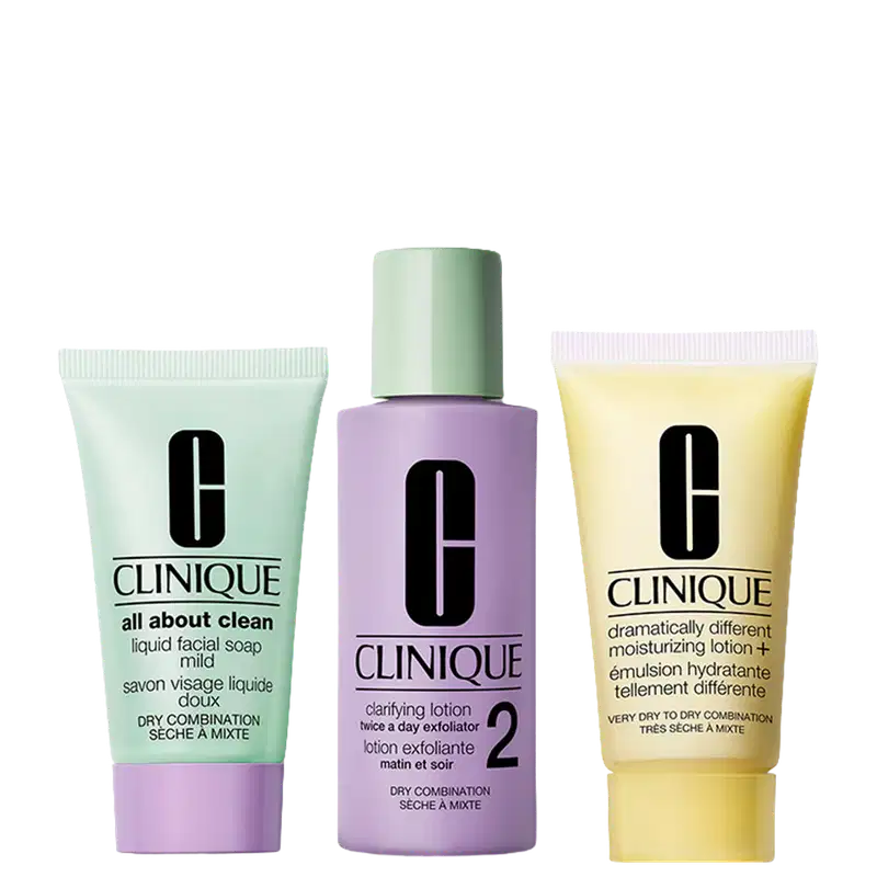 Kit de rotina de pele saudável para pele seca e mista. Contém limpador, esfoliante, loção clarificante e hidratante. Embalagem com frascos e tubos nas cores verde, lilás e amarelo com logotipo da marca Clinique.