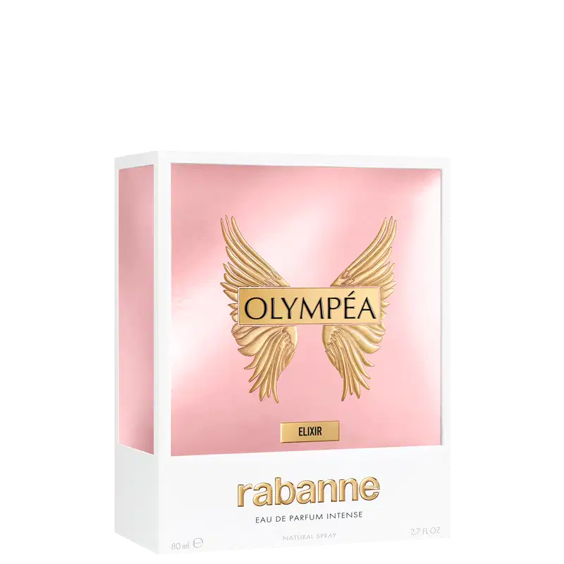 Caixa branca retangular com fundo rosa claro. Contém logotipo dourado da marca "Olympéa" e texto "Elixir" em dourado. Embalagem possui asas douradas na parte superior. 