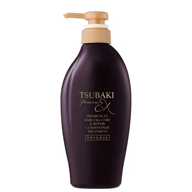 Frasco de condicionador Tsubaki Premium EX de 450ml, com embalagem roxa escura e rótulo dourado destacando os benefícios do produto.