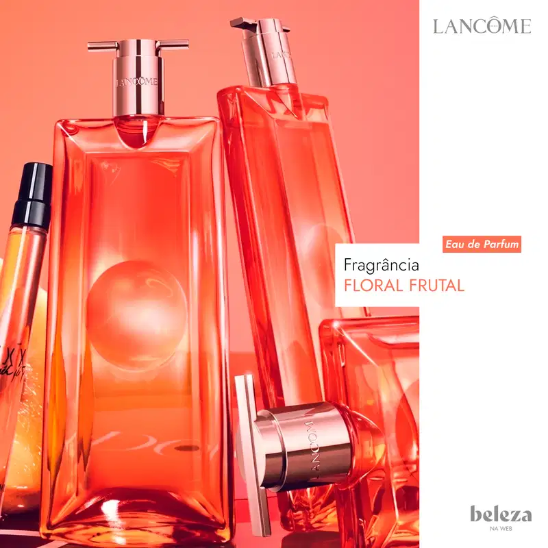 Frasco de perfume da marca Lancôme, com formato retangular e tampa rosada, em cor laranja vibrante.