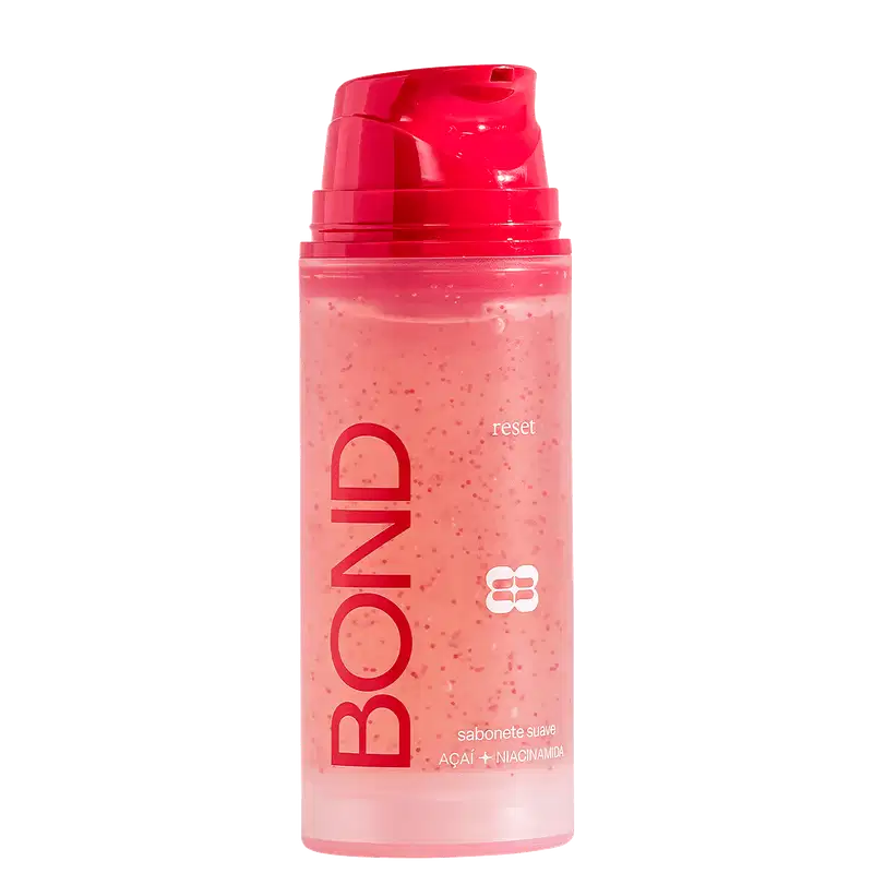 Frasco plástico rosa com tampa vermelha contendo sabonete líquido da marca Bond Rio com ingredientes de açaí e niacinamida, com texto "reset" visível no rótulo.