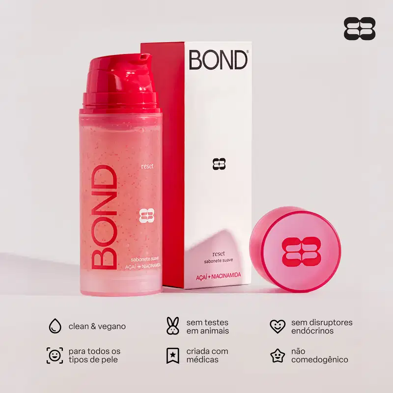 Embalagem vermelha e branca de item de perfumaria da marca Bond, com texto "reset sabonete suave" e "Acai + Niacinamida", além de ícones indicando ser produto vegano, sem testes em animais e sem disruptores endócrinos.