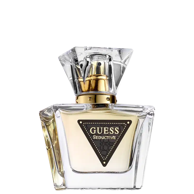 Frasco de perfume Guess Seductive com design geométrico em vidro transparente e detalhes dourados, rótulo preto com logotipo triangular.