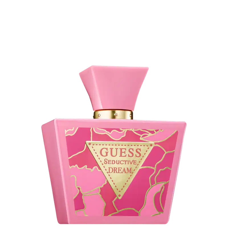Frasco de perfume Guess Seductive Dream, com embalagem rosa e detalhes dourados, incluindo um rótulo triangular com o nome da marca e a descrição do produto.