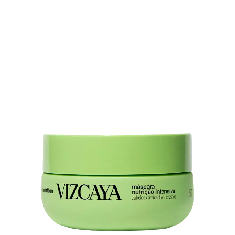 Embalagem verde-clara em formato de pote contendo a inscrição "VIZCAYA" e "máscara nutrição intensiva" em preto. O produto é destinado a cabelos cacheados e crespos.