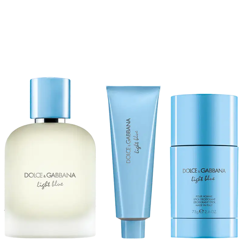 Conjunto de produtos de beleza da marca Dolce & Gabbana, incluindo um frasco de perfume Light Blue, um tubo de shower gel e um desodorante, todos em tons de azul e branco.
