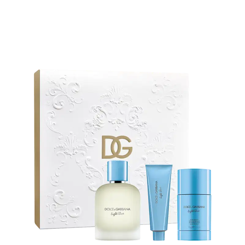 Conjunto de produtos de beleza Dolce & Gabbana Light Blue, incluindo um frasco de perfume, um tubo de shower gel e um desodorante, em uma caixa branca com detalhes florais em relevo.