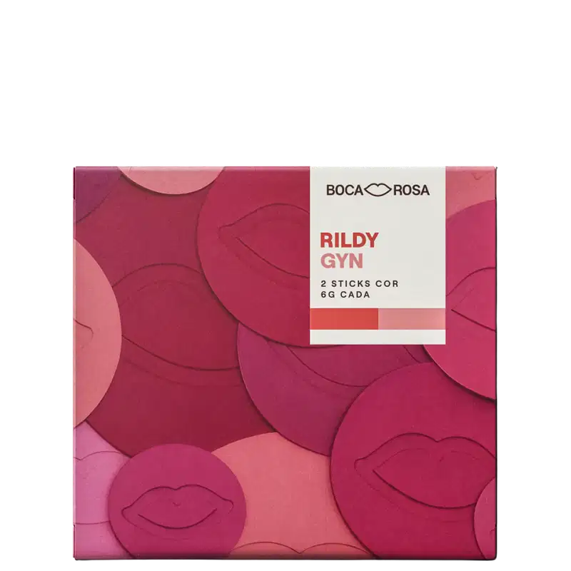 Embalagem Boca Rosa Rildy Gyn com 2 sticks cor rosa e vermelho, caixa quadrada em tons de rosa e vermelho com padrão de lábios em relevo.