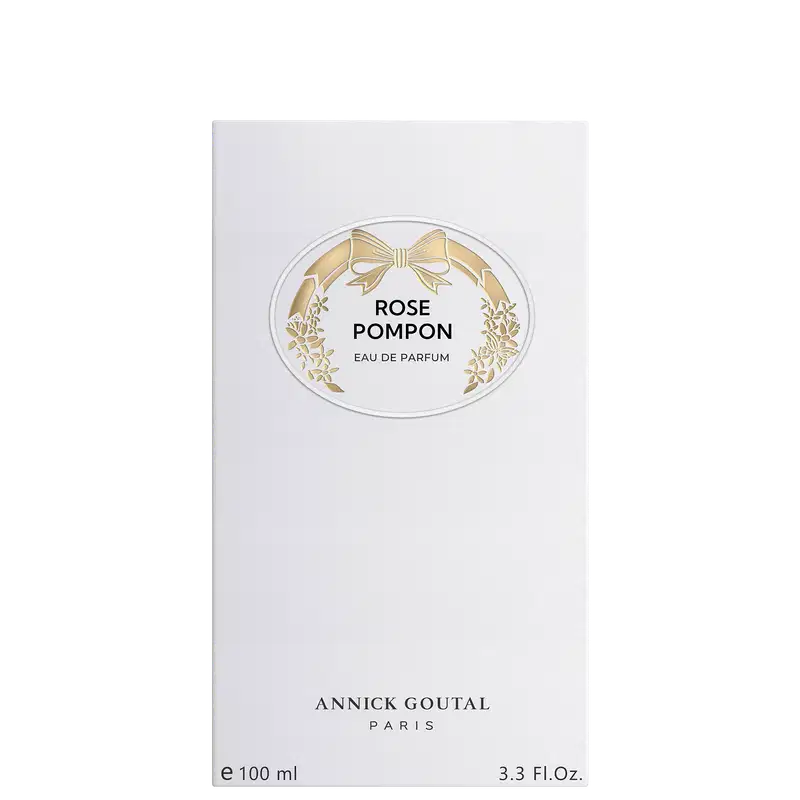 Eau de Parfum Rose Pompon da Annick Goutal Paris, 100ml. Embalagem branca com rótulo oval dourado decorado com laço e flores. Frasco de 3.3 Fl.Oz. Perfume francês de luxo com design elegante e sofisticado.