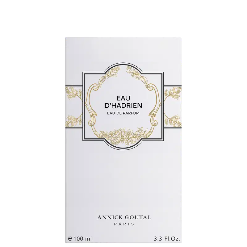 Eau de Parfum Eau d'Hadrien da Annick Goutal Paris em embalagem branca com ornamentos dourados. Frasco de 100ml (3.3 FL.Oz). Design elegante com moldura decorativa e detalhes florais em ouro.