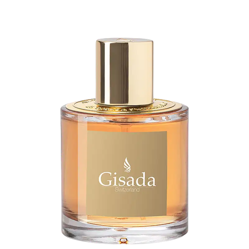 Perfume Gisada Switzerland em frasco cilíndrico de vidro com líquido âmbar. Tampa dourada cilíndrica. Rótulo bege com logo branco e texto "Gisada Switzerland". Design elegante e sofisticado.