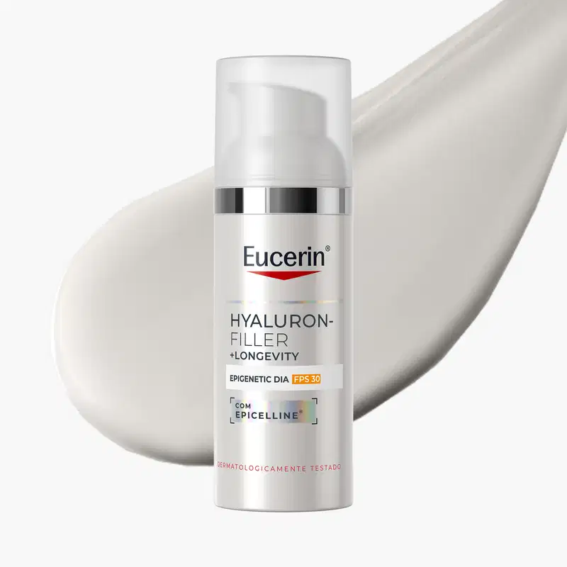 Embalagem branca e prateada de um produto de cuidados com a pele da marca Eucerin, com destaque para o nome "Hyaluron-Filler + Longevity" e informações sobre proteção solar FPS 30.