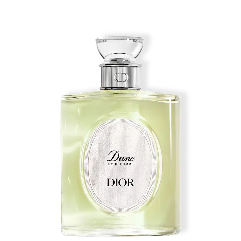 Perfume Dune Pour Homme Dior em frasco de vidro retangular com líquido amarelo-claro. Tampa prateada com detalhes em vidro transparente. Rótulo oval branco com inscrições em preto. Design elegante e minimalista.