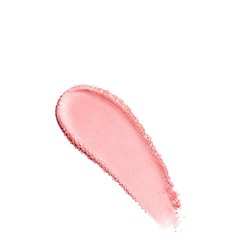 Amostra de blush em pó em tom rosado, aplicado em superfície branca.
