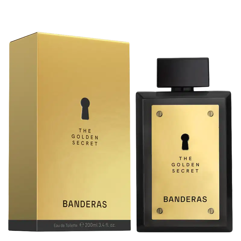 Frasco de perfume preto com painel frontal dourado exibindo o texto "The Golden Secret" e "Banderas" em letras douradas. O frasco possui um design elegante e minimalista, com um pequeno orifício no centro.