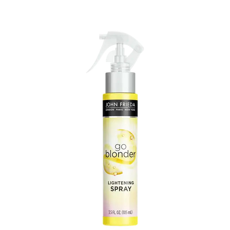 Embalagem plástica amarela com borrifador. O rótulo exibe o logotipo John Frieda em preto, o nome do produto "Go Blonder Lightening Spray".