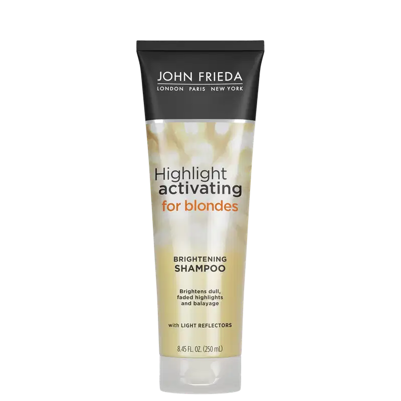 Embalagem tubular preta com detalhes dourados e texto branco. Rótulo indicando "Highlight activating for blondes Brightening Shampoo" (Shampoo ativador de luzes para loiras e iluminador). Menciona que ilumina luzes opacas, realça e revitaliza a cor.