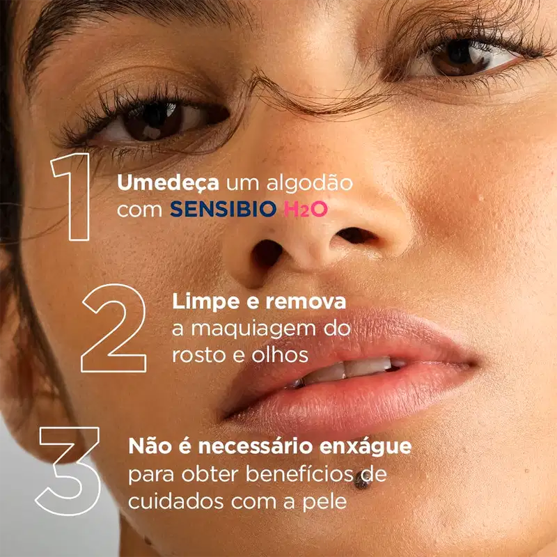 Imagem de um produto de maquiagem com texto em português: "Umedeça um algodão com SENSIBIO H2O. Limpe e remova a maquiagem do rosto e olhos. Não é necessário enxágue para obter benefícios de cuidados com a pele."