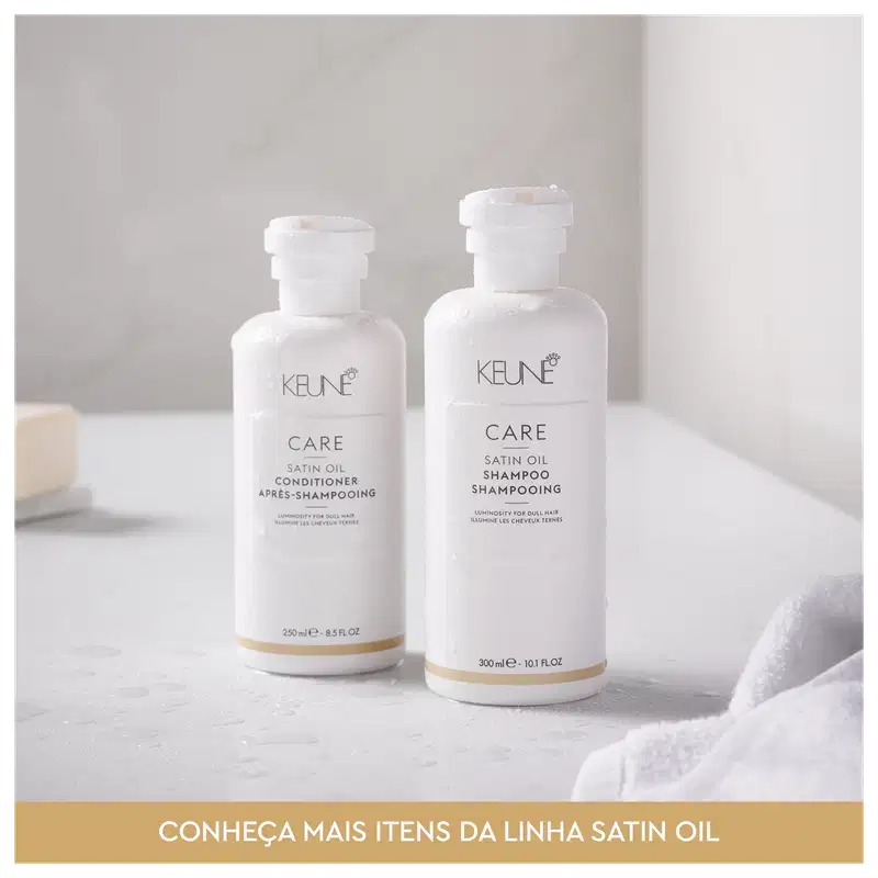 Frasco branco de 80 ml da linha Care da Keune, contendo o Shampoo de Óleo Satinado, com rótulo destacando a luminosidade para cabelos opacos.