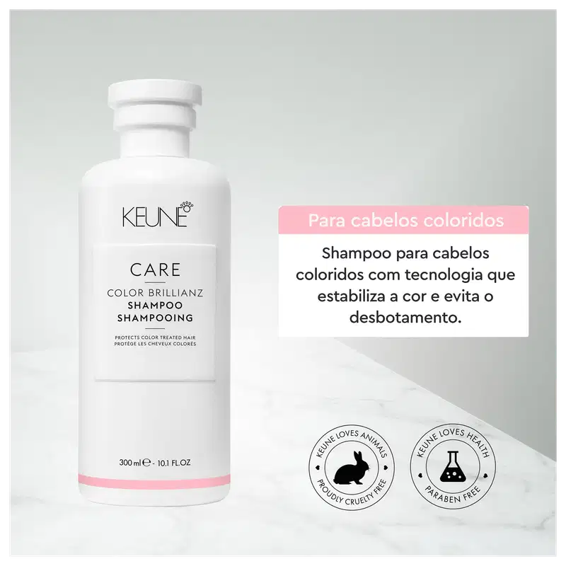 Frasco branco da linha Care da Keune, contendo Shampoo Color Brillianz para proteção de cabelos coloridos. Rótulo com nome do produto e informações sobre sua função de proteger a cor dos cabelos.