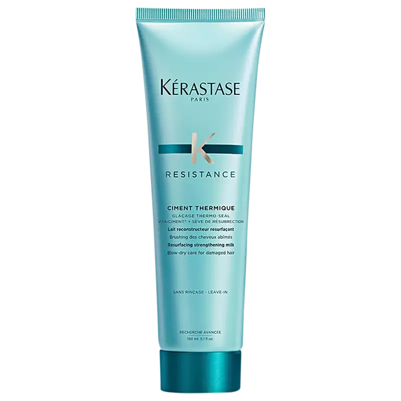 Tubo de tratamento capilar Kérastase Resistance Ciment Thermique, com embalagem de cor azul-esverdeada, contendo informações sobre o produto em inglês e francês.