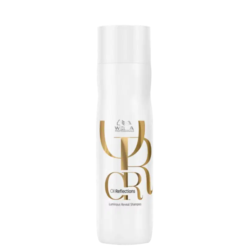 Frasco branco de shampoo da linha Oil Reflections da Wella Professionals, com rótulo dourado destacando o nome do produto "Luminous Reveal Shampoo".