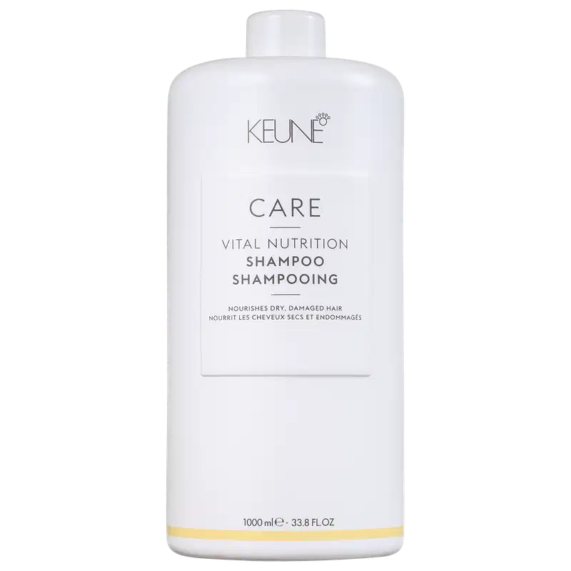 Frasco branco da linha Keune Care Vital Nutrition, contendo shampoo para cabelos secos e danificados. Rótulo com nome do produto e informações sobre o uso.
