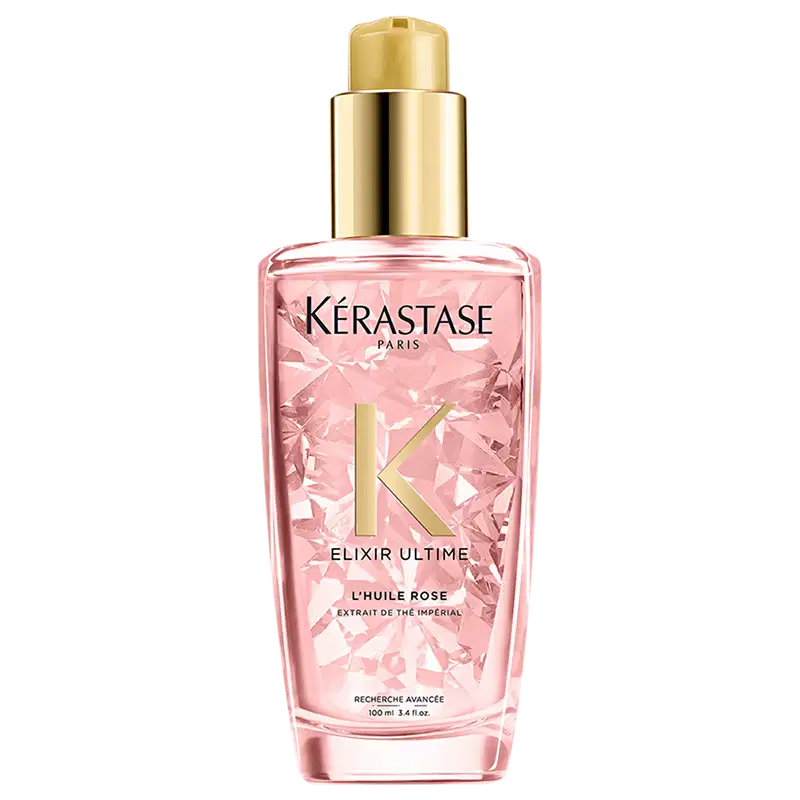Frasco rosa com tampa dourada contendo o produto "Elixir Ultime L'Huile Rose" da marca Kérastase Paris, um óleo capilar de tratamento.