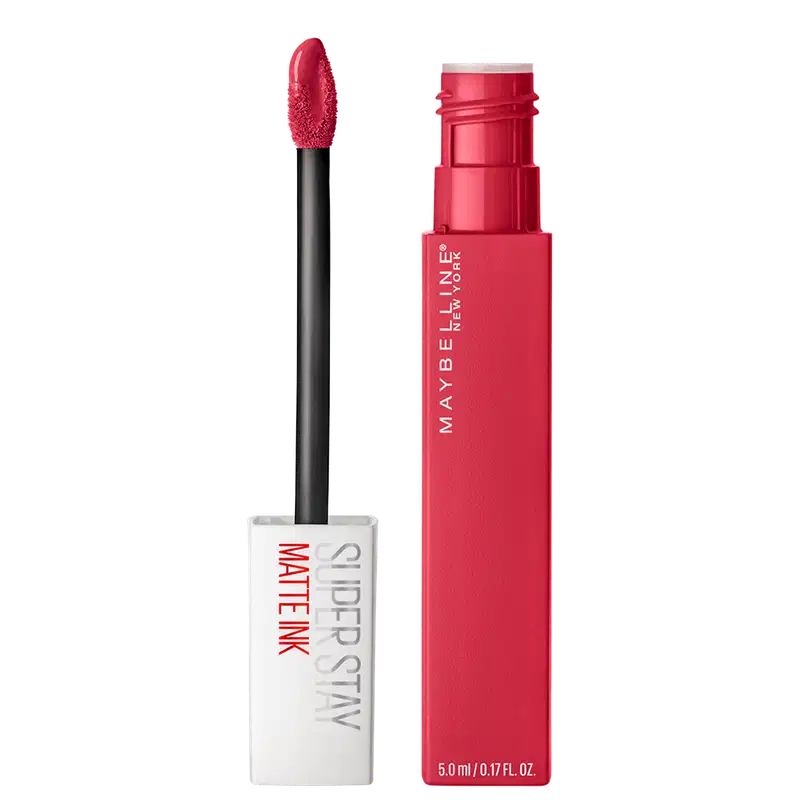 Tubo rosa vibrante com o nome da marca "Maybelline New York" impresso. Ao lado, um aplicador preto com uma ponta esponjosa em formato de lágrima.