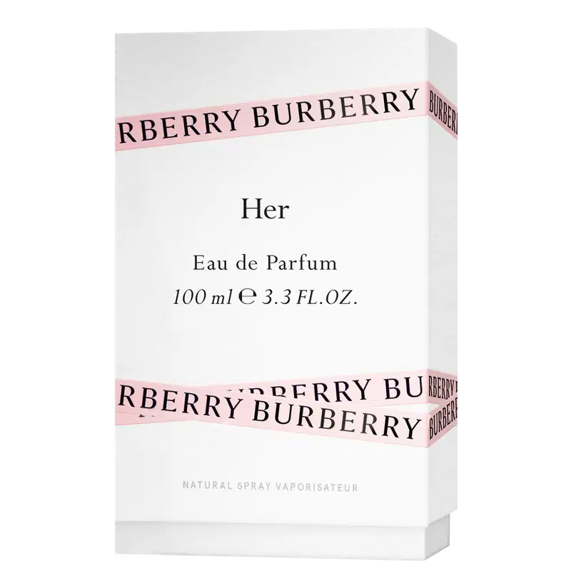 Frasco de perfume Burberry de cor rosa pálido com tampa dourada. O rótulo em destaque exibe o nome da marca "BURBERRY" em letras brancas.