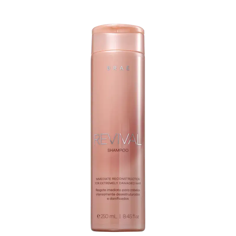 Frasco rosa de shampoo da marca Braé, chamado "Revival", com informações sobre reconstrução imediata para cabelos extremamente danificados.
