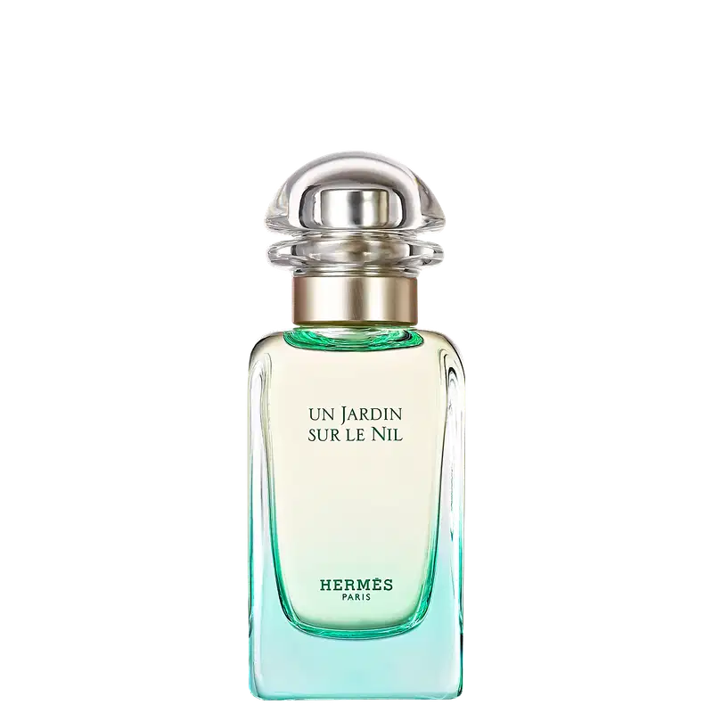 Frasco de perfume Hermès "Un Jardin sur le Nil", com design elegante em vidro e metal, rótulo em letras brancas sobre fundo verde claro, evocando uma fragrância fresca e natural.