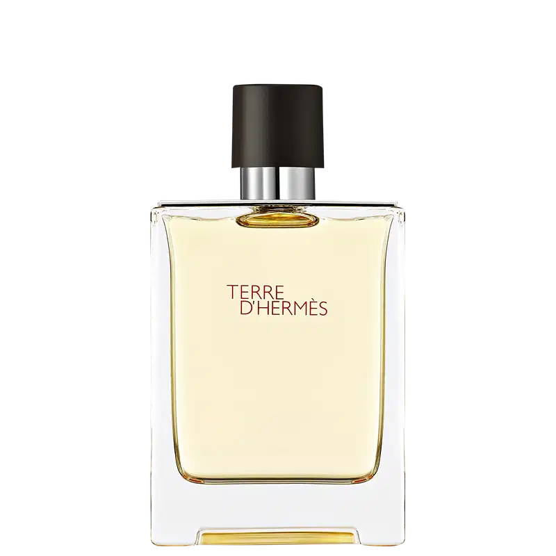 Frasco de perfume Terre d'Hermès com design elegante e minimalista em vidro transparente. Rótulo com texto em vermelho destaca o nome da fragrância.