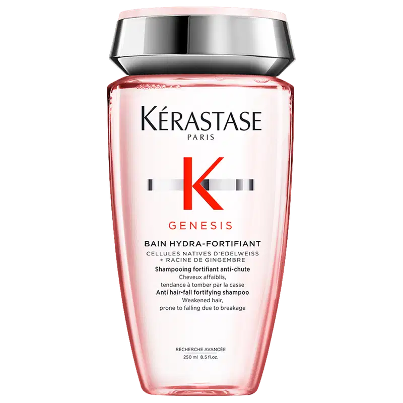 Frasco de shampoo da marca Kérastase Paris, da linha Genesis, com embalagem rosa e prata. O rótulo apresenta o nome da marca, da linha e informações sobre o produto, que é um shampoo fortificante anti-queda.