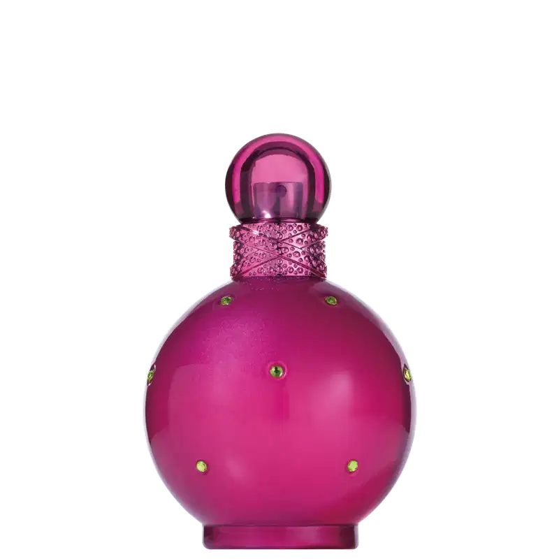 Perfume em frasco de vidro arredondado na cor rosa vibrante. O frasco possui detalhes decorativos rendados em volta do gargalo e pequenos cristais dourados incrustados no corpo. A tampa superior é uma esfera de vidro rosa escuro.