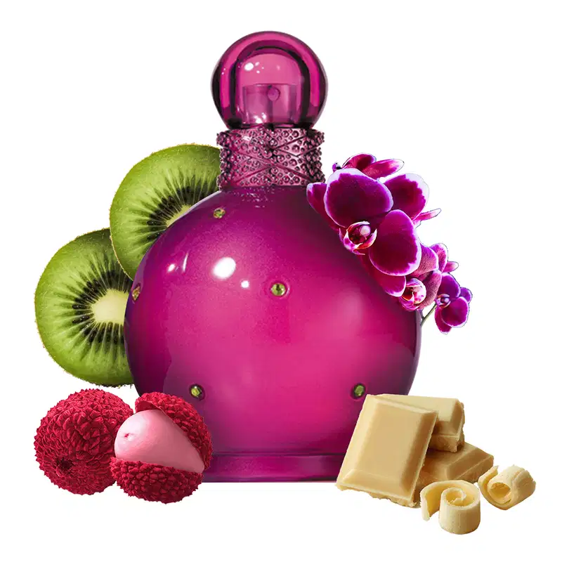 Ao redor do frasco, há elementos decorativos como orquídeas roxas, kiwis verdes e barras de chocolate branco. O conjunto remete a uma fragrância gourmand com notas frutadas e amadeiradas.
