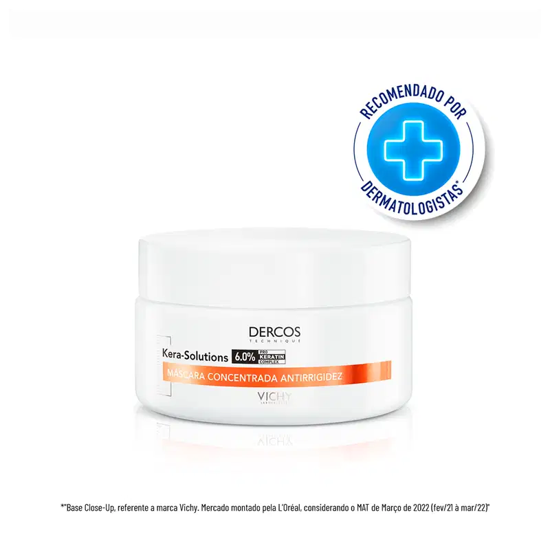 Frasco branco de máscara concentrada antirrigidez da marca Dercos, com 6,0% de queratina. Rótulo com logotipo azul e texto em espanhol indicando recomendação por dermatologistas.
