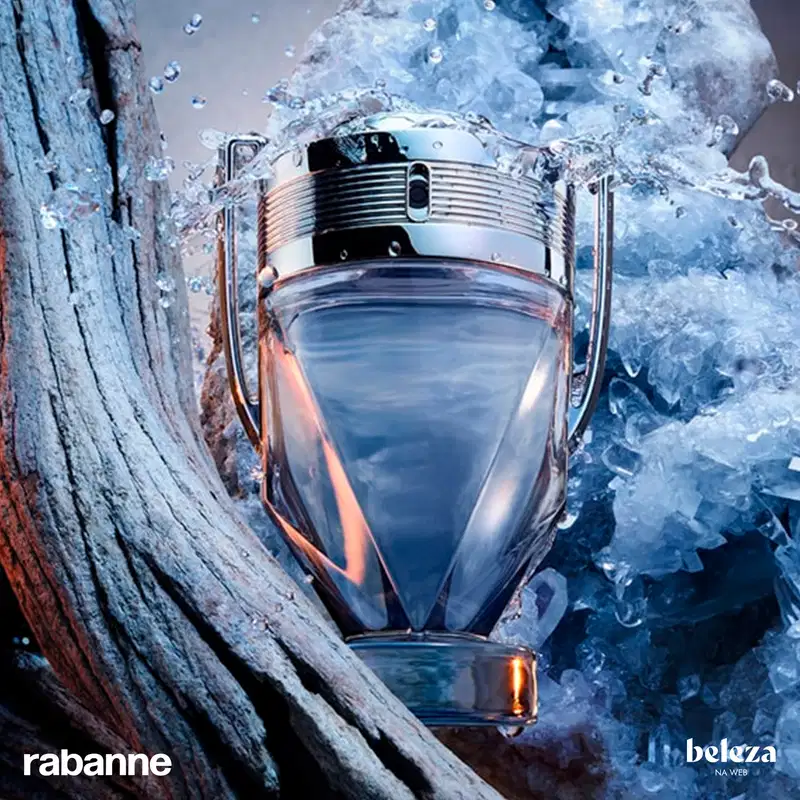 Frasco de perfume Invictus, da marca Paco Rabanne, com design elegante e moderno em tons de azul e prata, com detalhes metálicos na tampa.