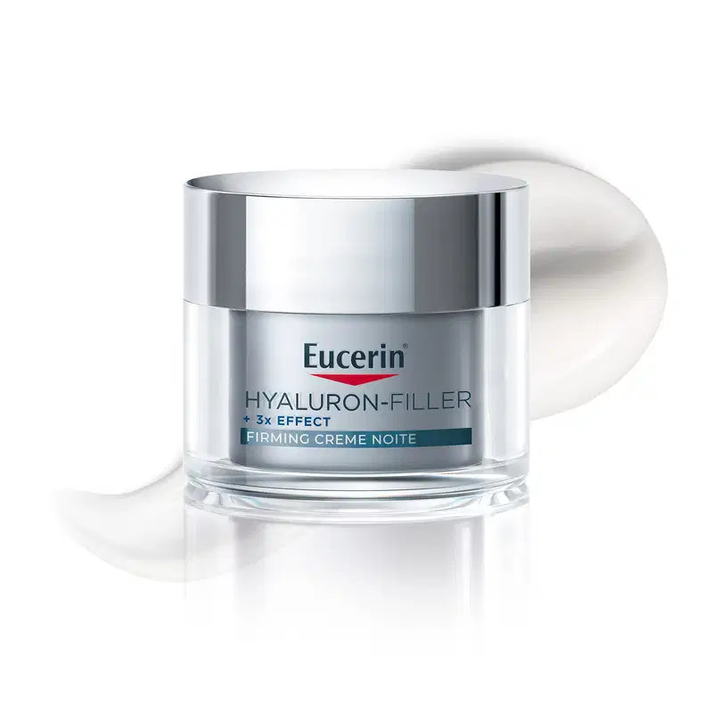 Pote de creme facial branco com tampa prateada da marca Eucerin, com textura lisa e brilhante, aparentando ser um produto cremoso e de consistência média.